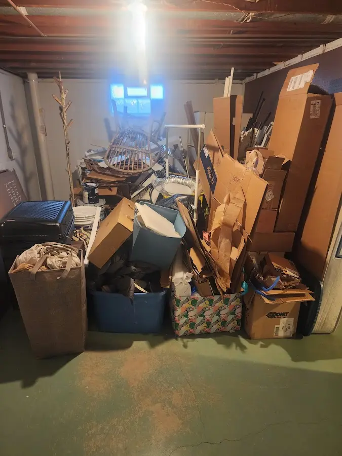 Roll-off dumpster container at job site for Yard Waste Dumpster Rental in Tomah