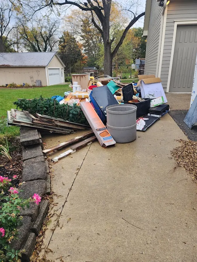 Dumpster being loaded with debris for Residential Dumpster Rental in Tomah
